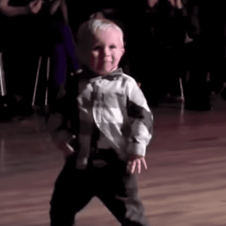 Little Baby hears favourite Elvis song at party and has the whole crowd cracking up at his moves
