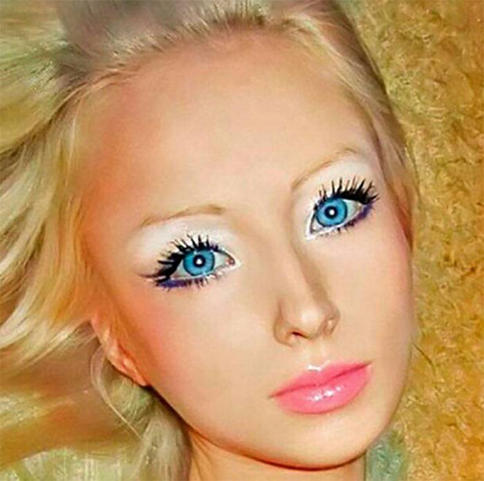The Human Barbie with no makeup. She still looks GORGEOUS.