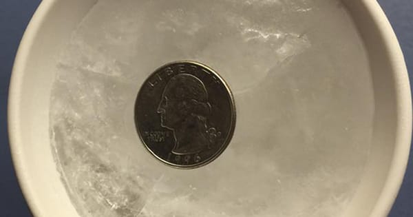 If you're away from home for travel or emergency, place a coin in the mug of ice in your freezer. Here's why