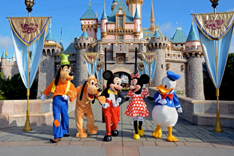 Two Girls Pose For A Photo At Disney World, But Look Closely At Minnie Mouse's Hands!