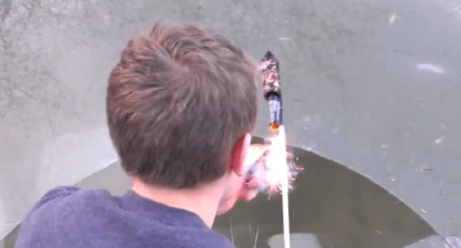Ever Wonder What Happens When You Fire A Rocket Firework In A Frozen Lake?