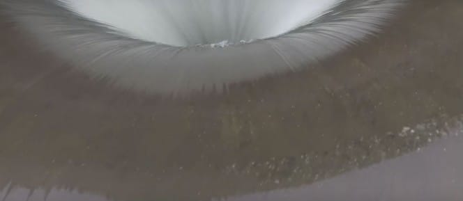 Bizarre Hole Formed In This Lake, So Someone Flew A Drone Inside And Captured This Footage