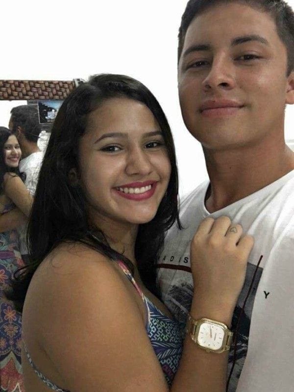 Couple share a cute selfie online - but there's something Very creepy going on in the background