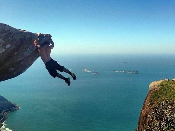 Solved! The truth behind that amazing photograph of a fitness fanatic dangling above a Brazilian beach